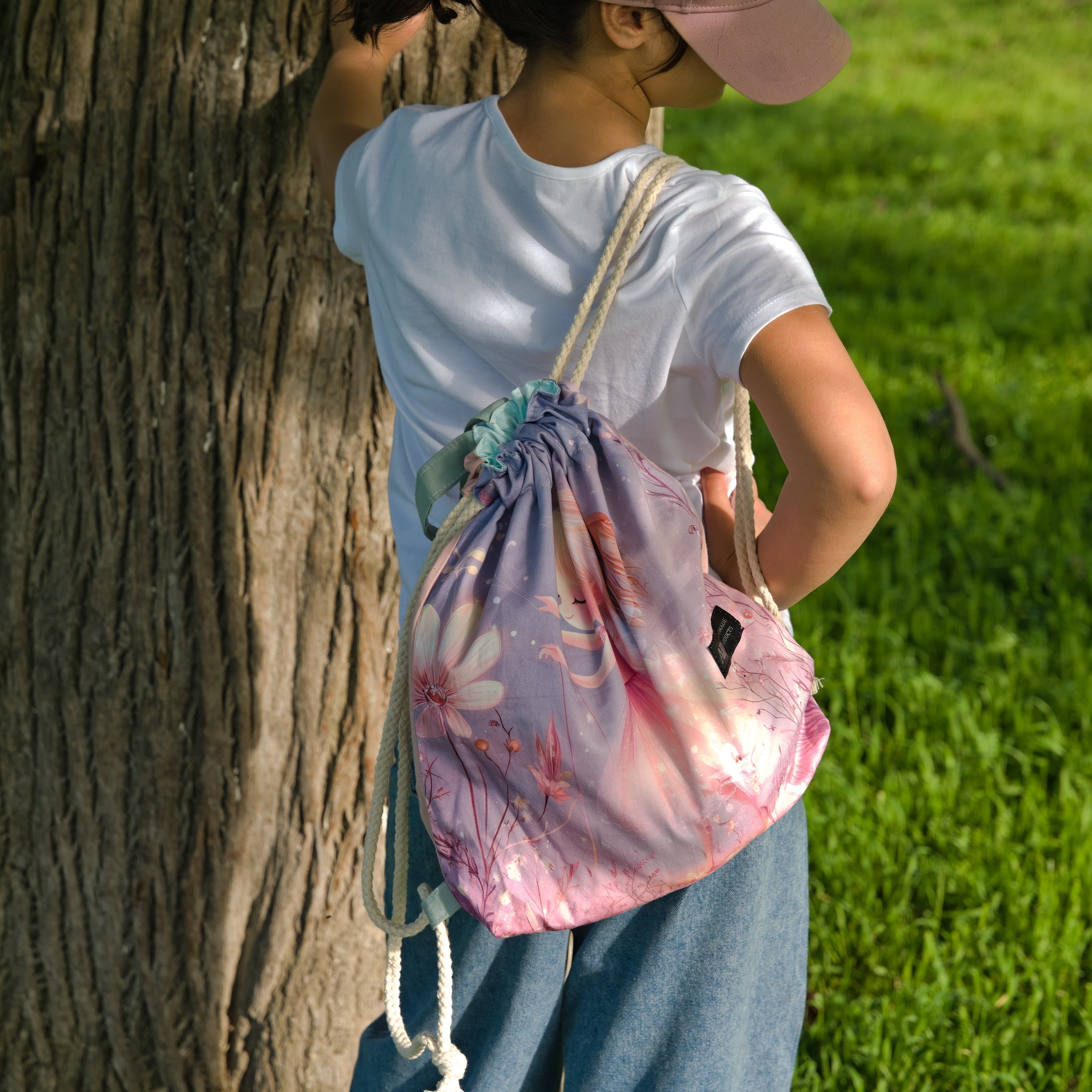 Purple Drawstring Backpack With a Print of a Girl