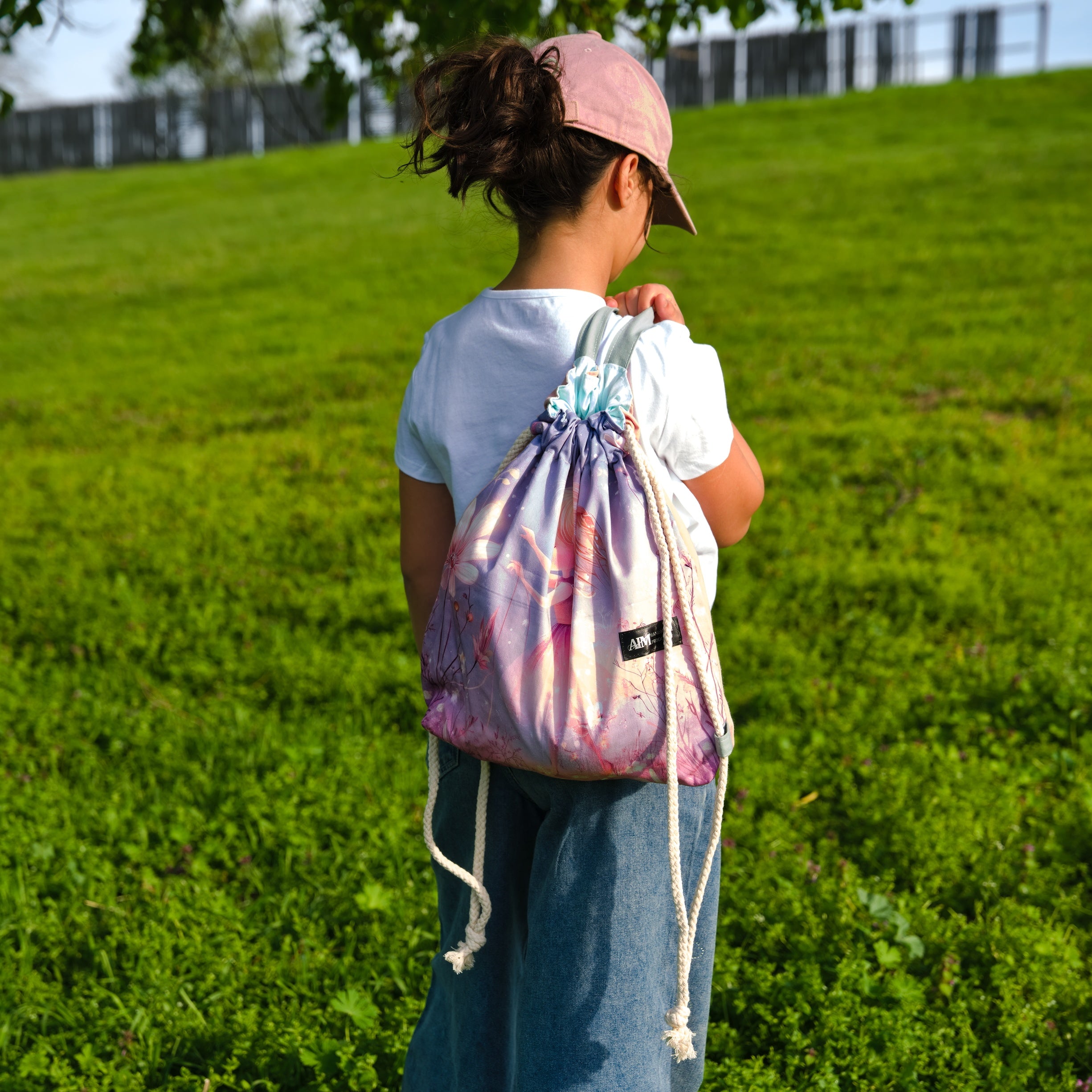 Purple Drawstring Backpack With a Print of a Girl