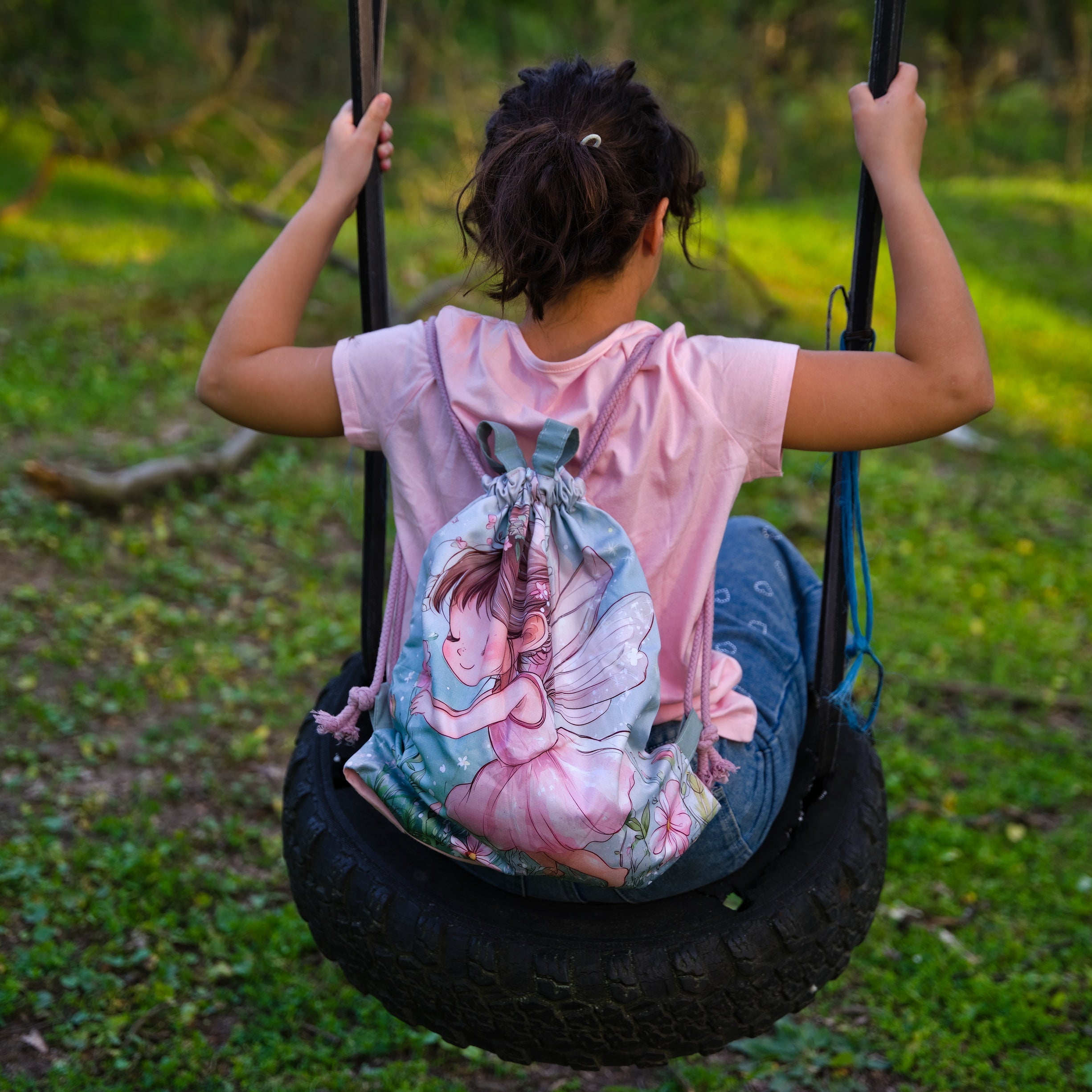 Green Drawstring Backpack With a Print of a Girl