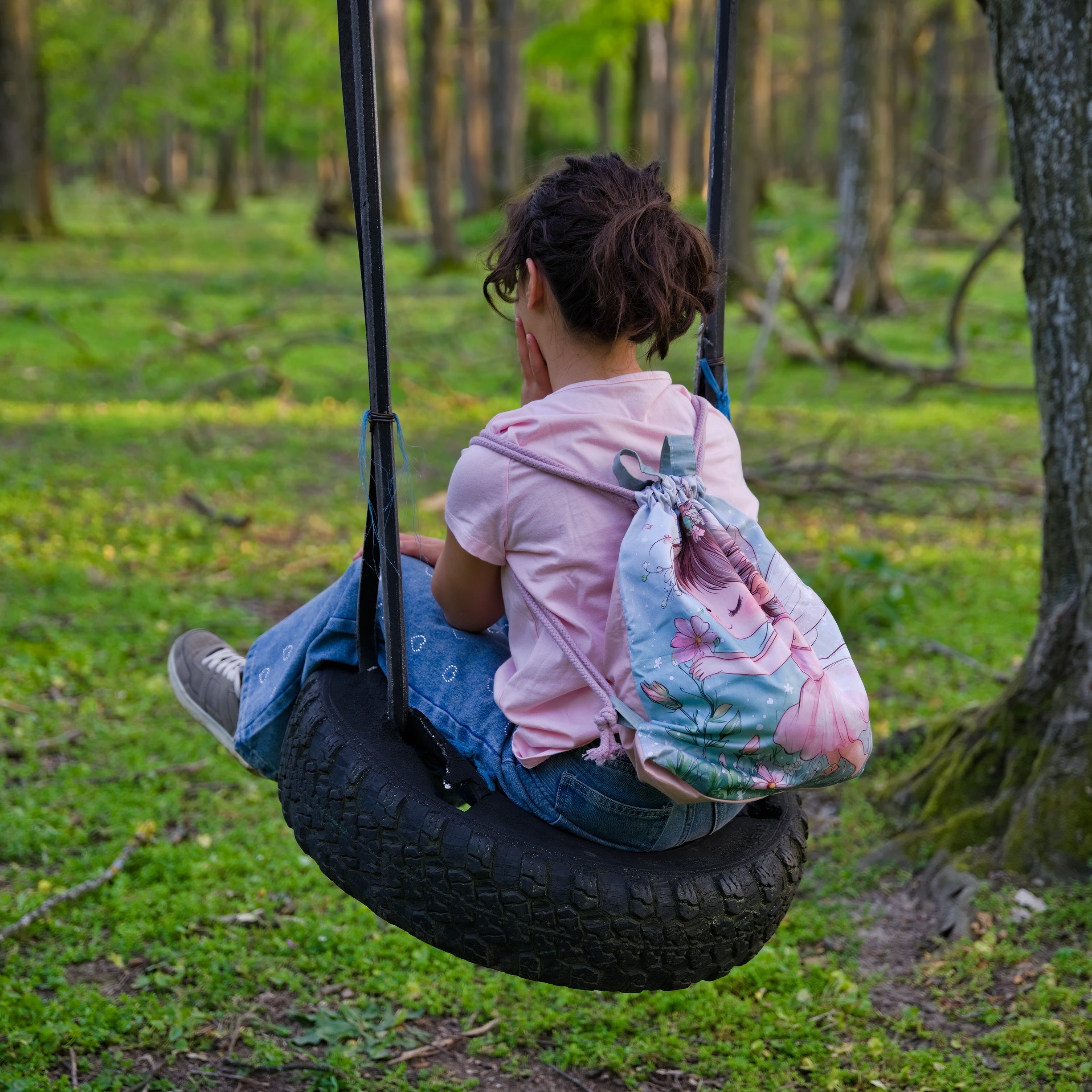 Green Drawstring Backpack With a Print of a Girl