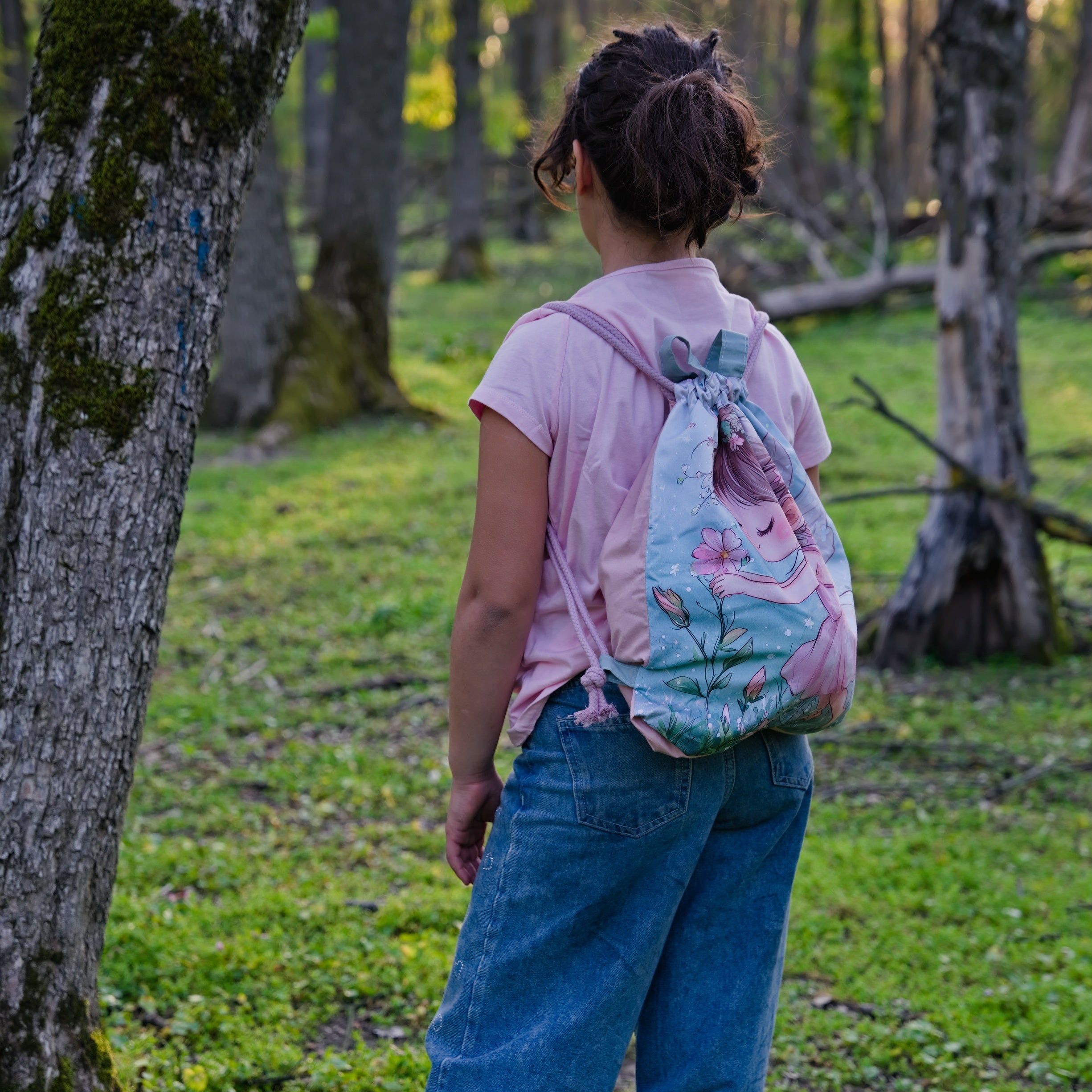 Green Drawstring Backpack With a Print of a Girl
