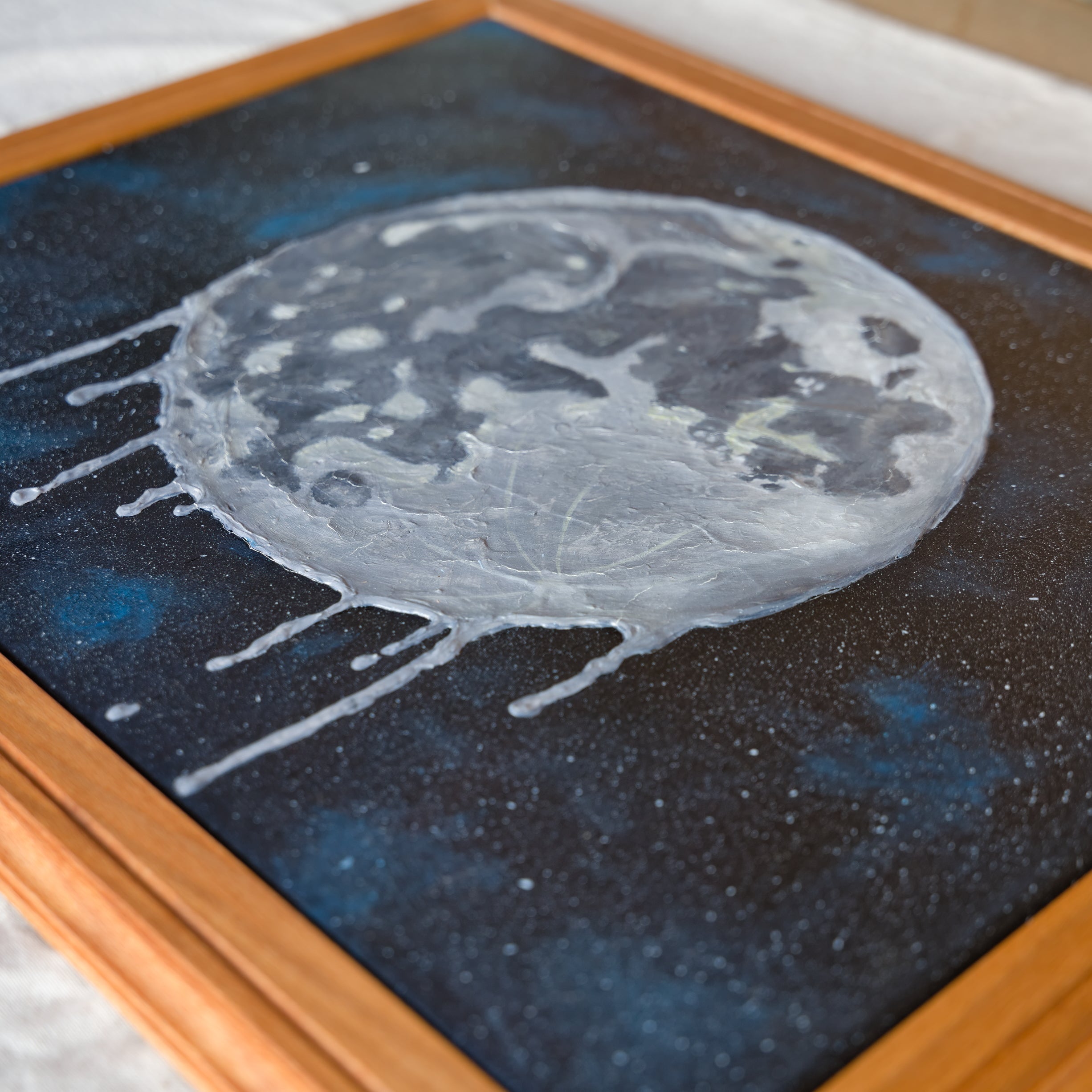 Melting Moon Canvas – Framed Space Art with Starry Night Background
